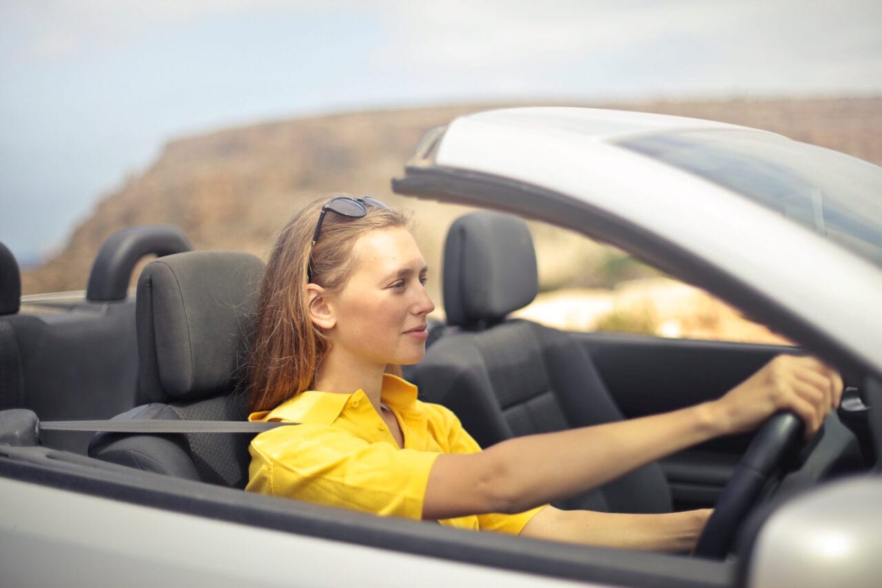 A Safe, Independent Driver A woman demonstrating safe, independent driving having passed her test.