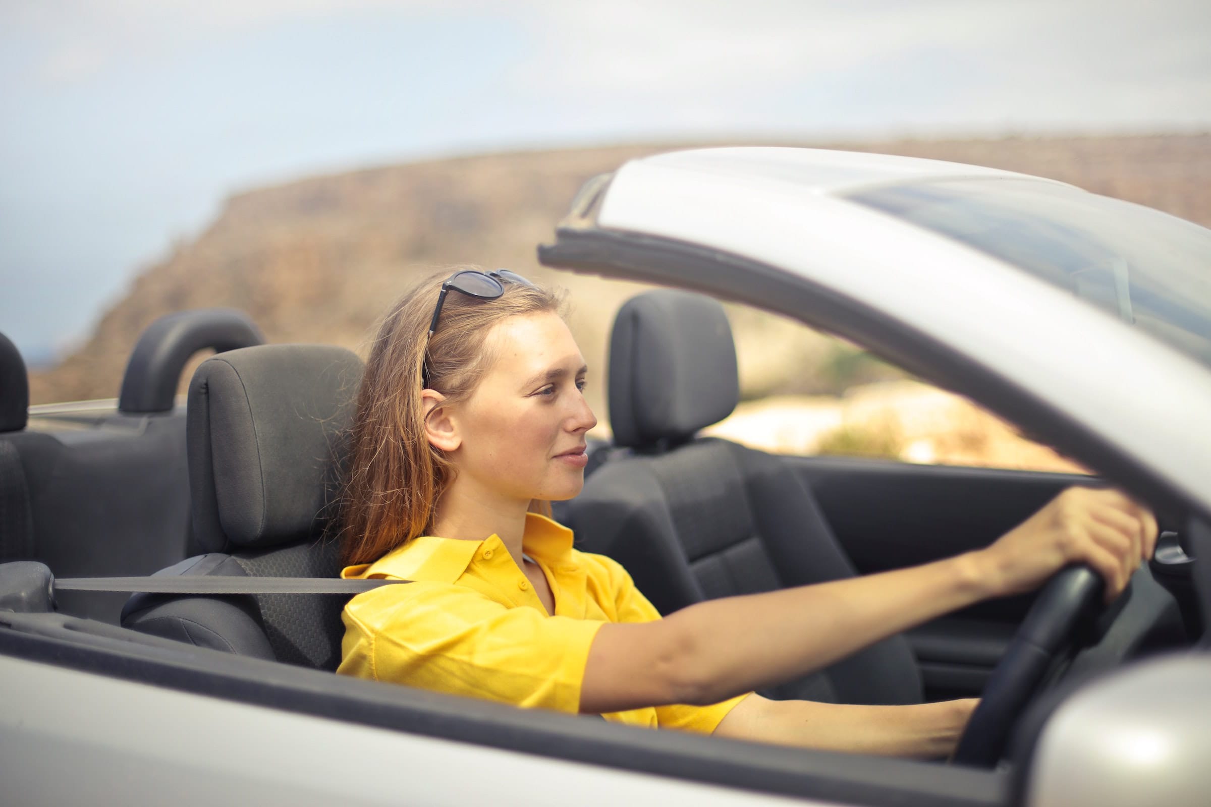 A woman demonstrating safe, independent driving having passed her test.