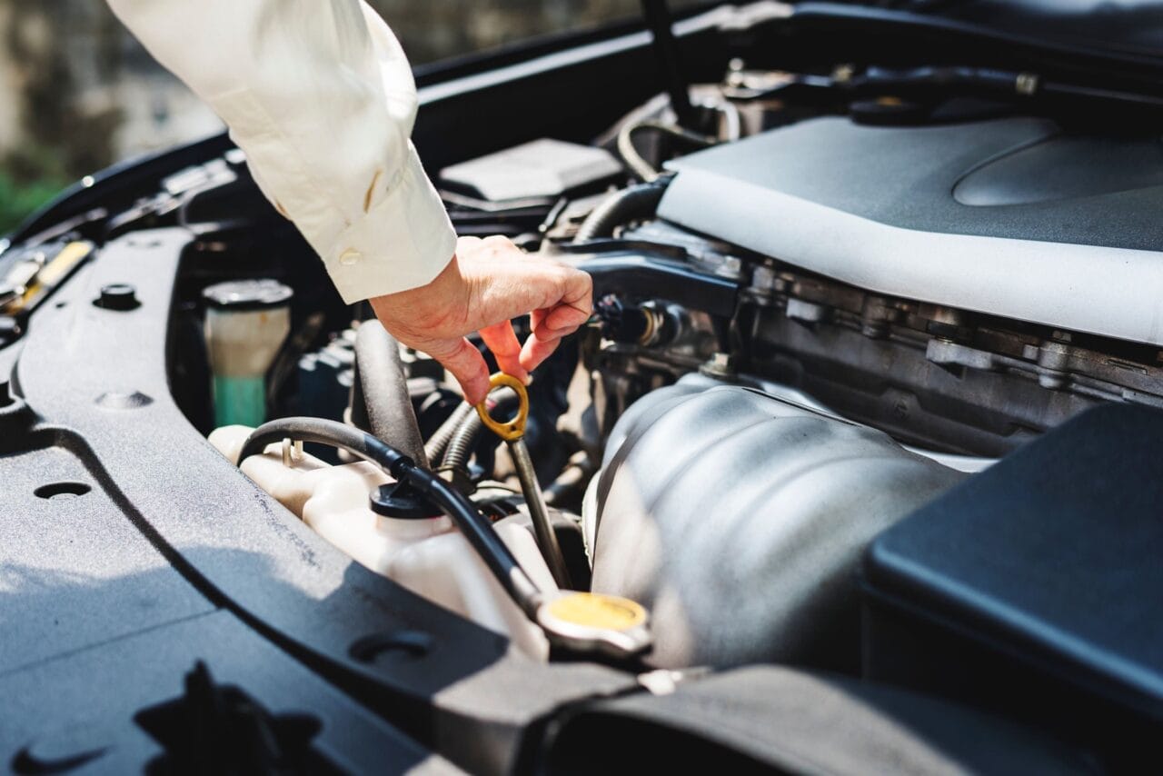 Engine Dipstick Man checking engine oil level. This might be one of your 'show me, tell me' questions.
