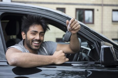 Picture showing driver holding a car key